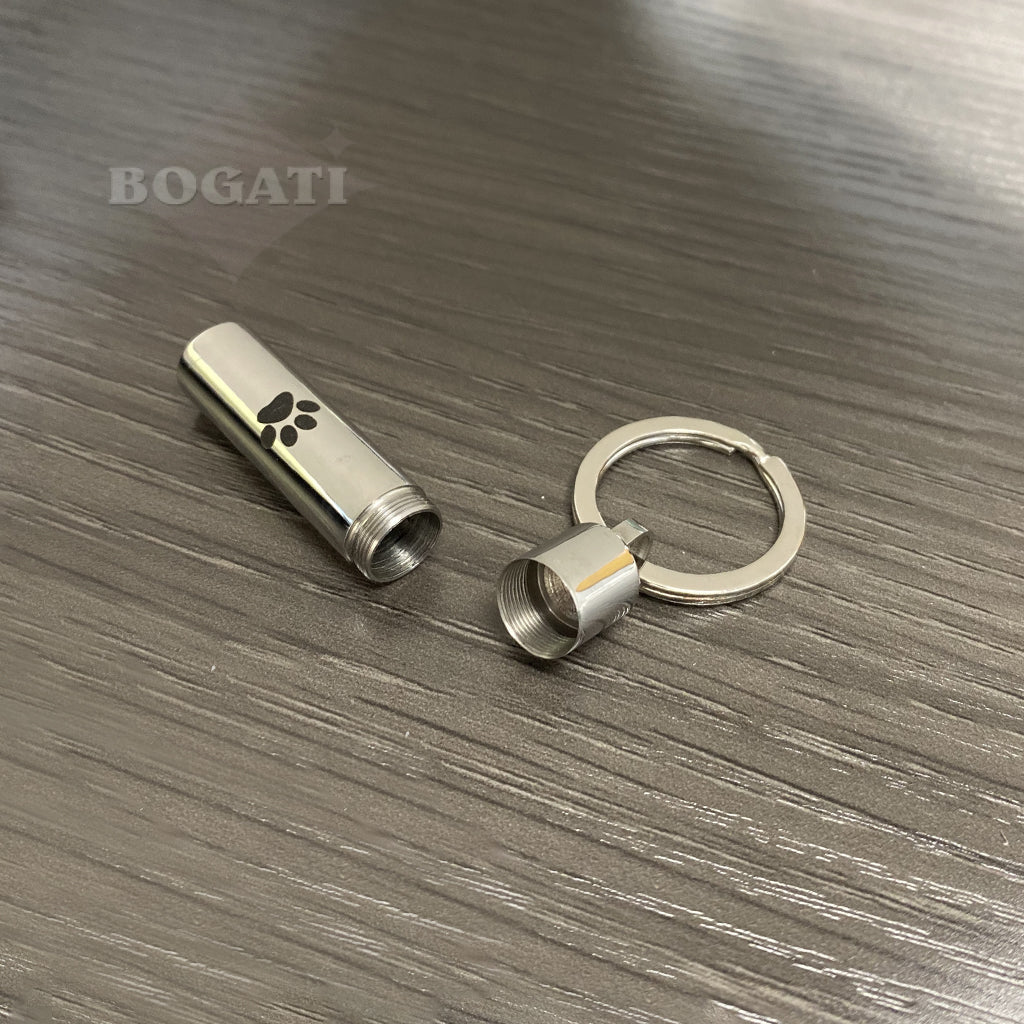 J-016 - Cylinder with Black Paw Print - Silver-tone - Keychain