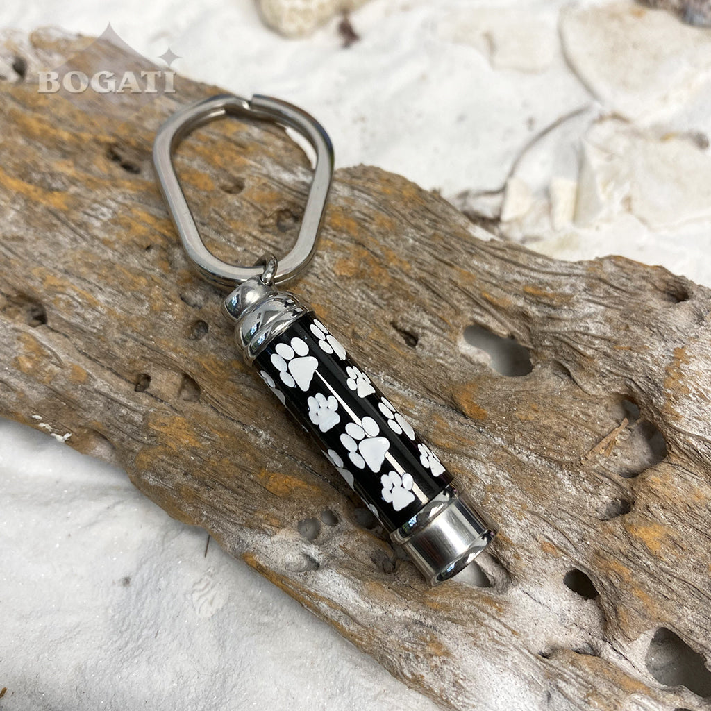 J-076 - Black Banded Cylinder with White Paw Prints - Keychain