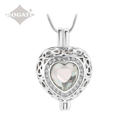 J-806 Silver-tone Heart Locket with Birthstone Simulated Gem April