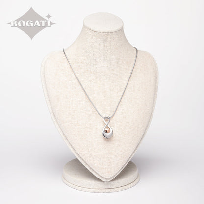 J-997 - Infinity Symbol with rose gold Heart